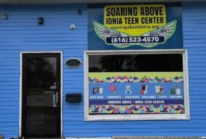 front of Soaring Above Teen Center building